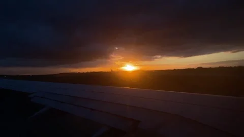 Airplane Wing with Sunset View from Window Vídeo Stock 277610425