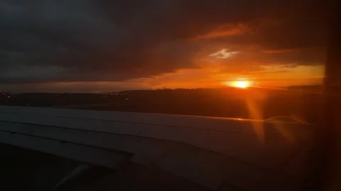 Airplane Wing with Sunset View from Window Stock Footage 277610498
