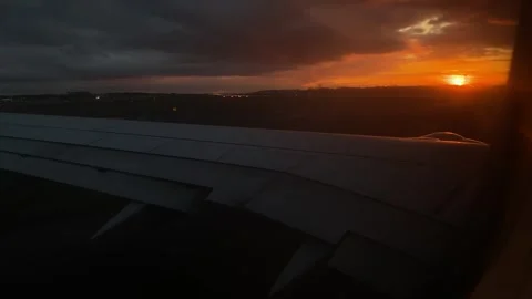 Airplane Wing with Sunset View from Window Stock Footage 277610508