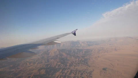 Airplane wing through an illuminator Stock Footage 147673514