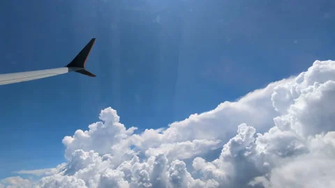 Airplane wing tip blue sky white clouds Stock Footage 224808523