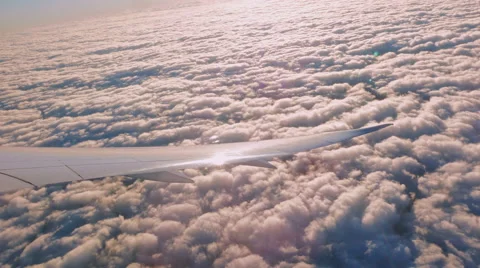 Airplane Wing Turning above clouds Stock-Footage 45286300