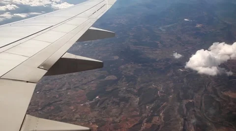 Airplane wing turning during flight, plane wing from inside Stock Footage 45158977