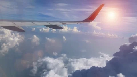 Airplane Wing View Above the Clouds at Sunset Stock Footage 310217212