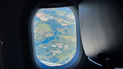 Airplane wing view above clouds Stock Photos