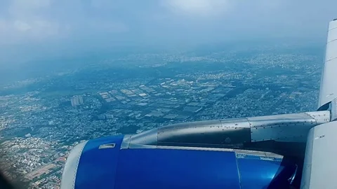 Airplane wing view approaching clouds during ascent Stock Footage 333453936
