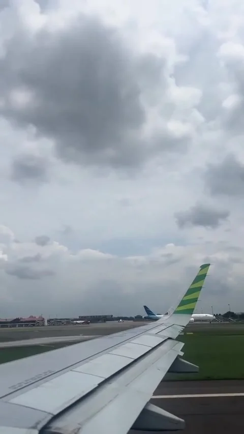 Airplane Wing View During Takeoff with Cloudy Sky Stock Footage 292049367