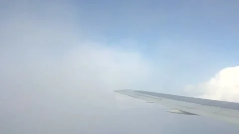 Airplane Wing View Flying Over Clouds  Stock Footage 219298080