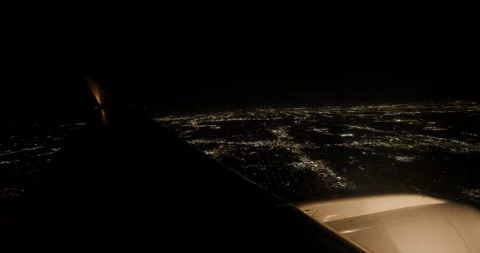 Airplane Wing View Flying Over Dallas City Lights at Night Stock Footage 329249862