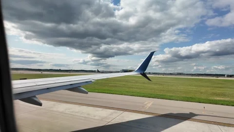 Airplane Wing View as It Prepares for Takeoff From the Runway Stock Footage 288902715