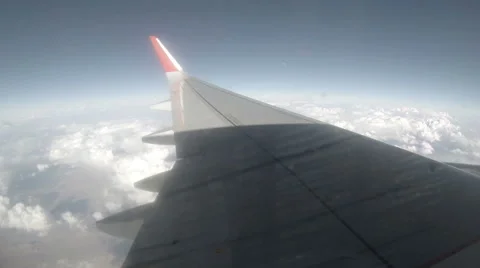 Airplane wing, view out of window on blue sky background, Full HD (timeLapse) Stock Footage 41868636