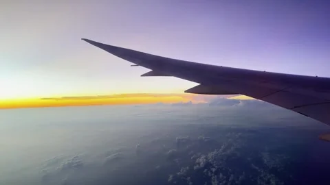 Airplane wing view at sunset Video stock 304554832