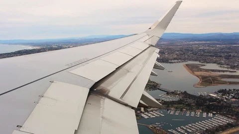 Airplane Wing View at Take Off Over Coastline Stock Footage 106085964