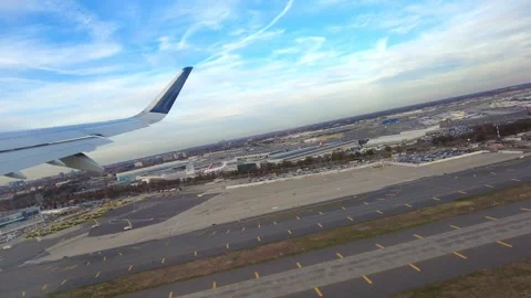 Airplane wing view take off taking off at new york john f kennedy international Stock Footage 257472729