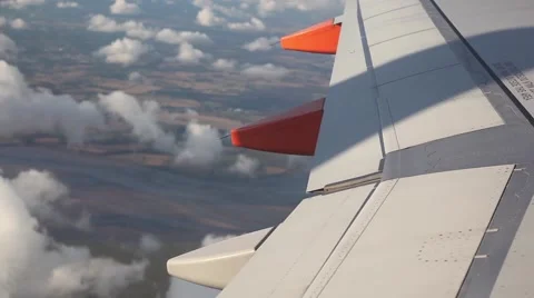 Airplane wing from window with beautiful clouds Video stock 45070750