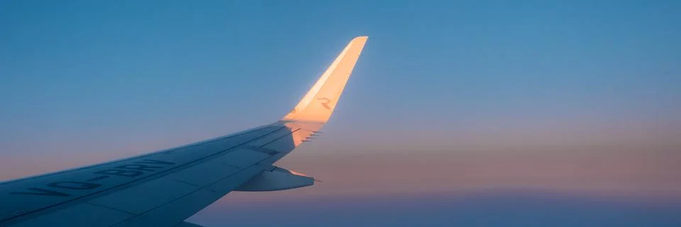 Airplane wing from window. Stock Photos