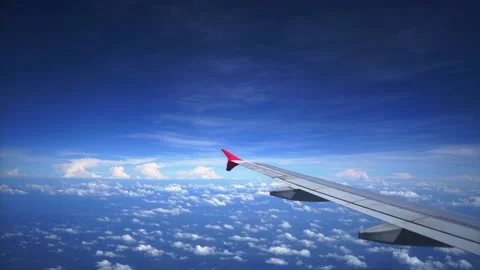 Airplane wings against tiny cloud sky. Stock Footage 144312752