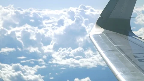 Airplane Wingtip and clouds in the sky Stock Footage 87770902