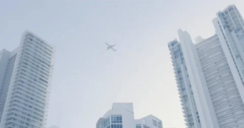 Airplanes flying over building Stock Footage 204875935