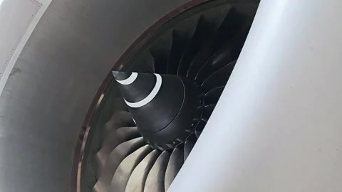 Airplane's jet engine spins at speed as the wind blows past it. Stock Footage 252586714
