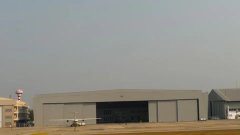Airplanes parked outside hangars at Don Mueang Airport Video stock 337158598