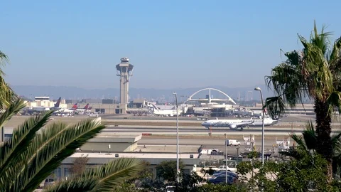 Airplanes prepare for take off at LAX international airport in Los Angeles, CA Stock Footage