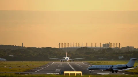 Airplanes queue for takeoff and landing at the runway Stock Footage 129149435