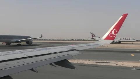 Airplanes in queue taxiing on the runway Stock Footage 109794983