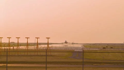 Airplanes Taking Off At Sunset Stock Footage 316784977