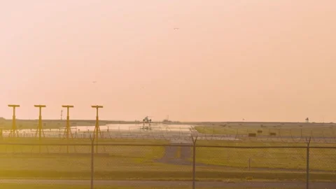 Airplanes Taking Off At Sunset Stock Footage 316784978