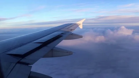 Airplane's wing in the air, flying, flaps (poilers) going down Stock Footage 78010612