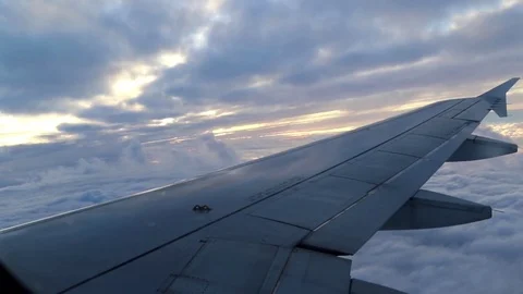 Airplane's wing in the air, going down and up, airplane turning Stock Footage 78011967