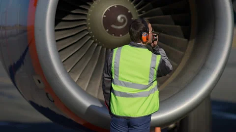 Airport. Aircraft engineer worker mechanic controlling work airdrome. Man Stock Footage 166830208