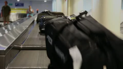 Airport baggage belt with moving luggage Stock Footage