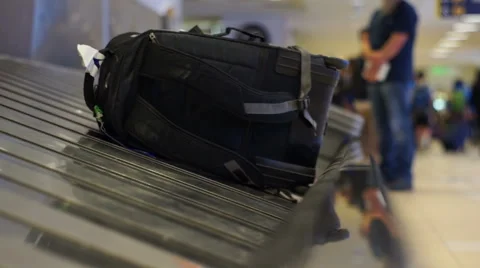 Airport Baggage Carousel with a Backpack Stock Footage 61959077