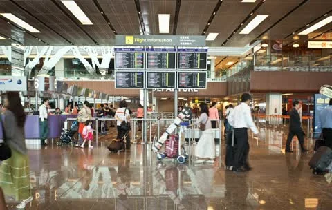 Singapore airport passengers pass Louis , Stock Video