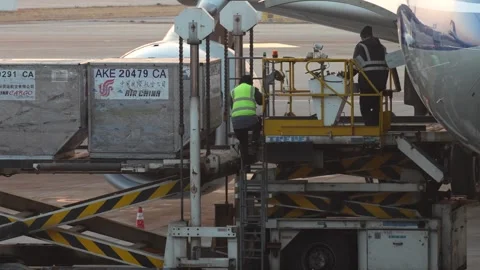 Airport ground crew in action, loading cargo containers. Stock Footage 265873164