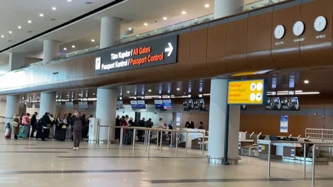 Airport interior with people in queue for passport control under multilingu.. Stock Footage 331215985