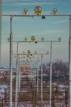 Airport landing lights against a clear sky Stock Photos