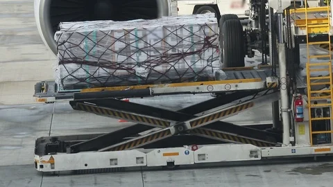 An airport - loading the baggage in the plane Stock Footage 121427135