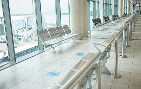 Airport, lounge chairs and terminal waiting room for global travel, covid Stock Photos