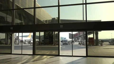Airport operations viewed through the window on the ground floor Stock Footage 158467689