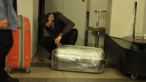 At the airport: packing baggage  Video stock 45576717