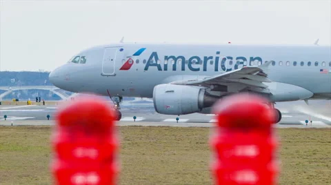 Airport Runway Lights Focus Pull to American Airlines Airliner Stock Footage 67577208