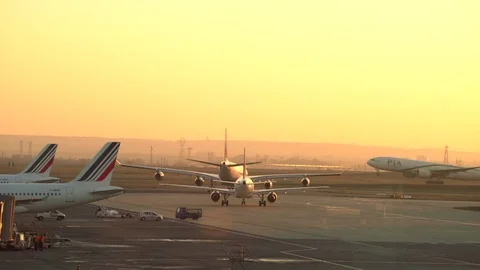 Airport runway at sunset. Plane take off - Char de gaulle, Paris Stock Footage