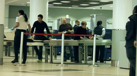 Airport Security - Guard checking people's luggage. Stock-Footage 36429701