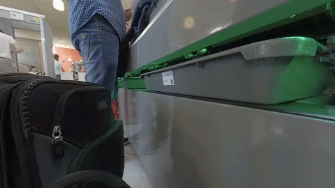 Airport security as plastic trays pulled out by travellers v2 Stock Footage 118208294