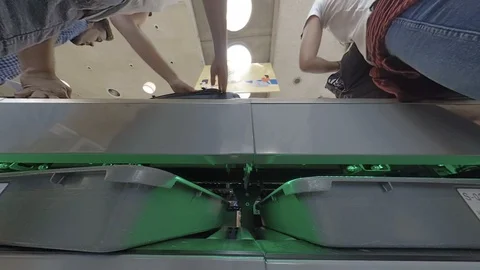 Airport security as plastic trays pulled out by travellers Stock Footage 118208296