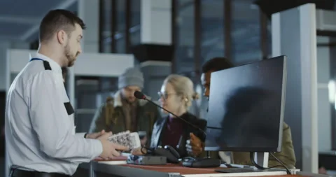 Airport security processing a thumb print Stock Footage 87133936