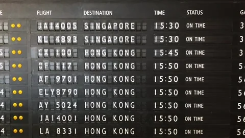 Airport split-flap display board showing arrivals and departures at Sydney Stock Footage 295942973